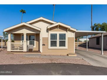 Charming single-wide manufactured home with covered porch at 649 N 67Th Dr # 25, Phoenix, AZ 85043