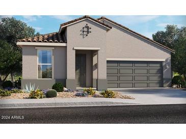 Charming one-story home with a two-car garage and desert landscaping at 20620 N Confetti Ct, Maricopa, AZ 85138