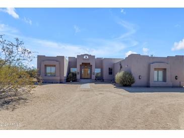 Spanish style home with a large front yard at 38332 N 25Th Ave, Phoenix, AZ 85086