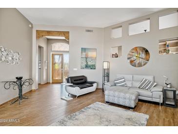 Living area with hardwood floors, neutral walls, and stylish furniture at 15832 E Brittlebush Ln, Fountain Hills, AZ 85268