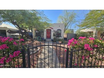 Charming house with red door and beautiful landscaping, gated entry at 2322 N 8Th St, Phoenix, AZ 85006