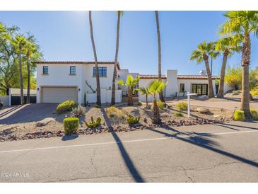 Stunning Spanish style home with palm trees at 4333 E Mcdonald Dr, Phoenix, AZ 85018