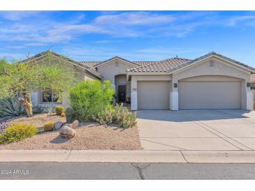 Single-story home with two-car garage and desert landscaping at 5221 E Thunder Hawk Rd, Cave Creek, AZ 85331