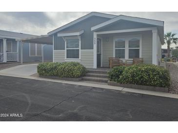 Exterior view of a manufactured home with gray and beige siding at 650 N Hawes Rd # 4409, Mesa, AZ 85207