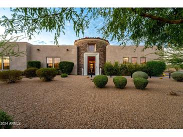 Stunning two-story home with stone accents and desert landscaping at 8742 E Villa Cassandra Dr, Scottsdale, AZ 85266