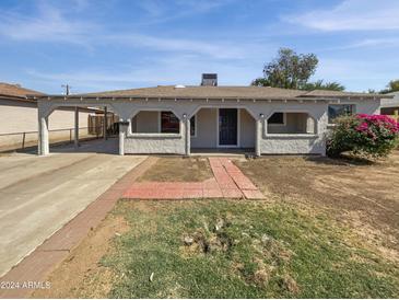 House exterior with front yard and walkway at 4321 N 50Th Dr, Phoenix, AZ 85031