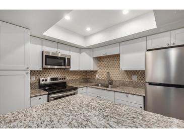 Kitchen with granite countertops and stainless steel appliances at 18202 Cave Creek Rd # 111, Phoenix, AZ 85032