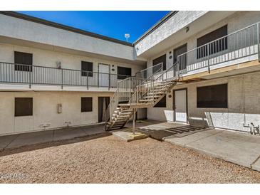 Exterior view of apartment building with stairs and gravel at 18202 Cave Creek Rd # 151, Phoenix, AZ 85032