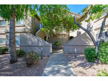 Attractive building exterior with landscaping and walkway at 15380 N 100Th St # 2101, Scottsdale, AZ 85260