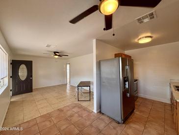 Kitchen and living room with tile floors at 4502 W Crittenden Ln, Phoenix, AZ 85031