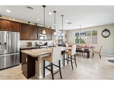 Modern kitchen with large island, stainless steel appliances, and ample counter space at 21048 W Coronado Rd, Buckeye, AZ 85396