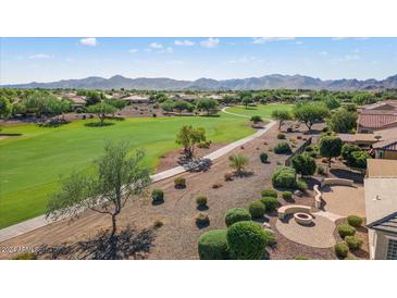 Community view with houses and golf course at 20447 N 266Th Ave, Buckeye, AZ 85396