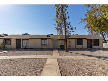 Front view of a triplex style building at 3646 N 69Th Ave # 60, Phoenix, AZ 85033
