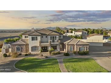 Luxury two-story home with stone and stucco exterior at 3520 E Pearl Cir, Mesa, AZ 85213