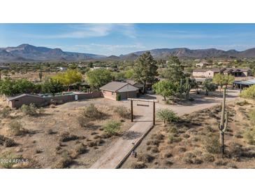 Aerial view of a ranch style home with pool and mountain views at 39839 N Spur Cross Rd, Cave Creek, AZ 85331