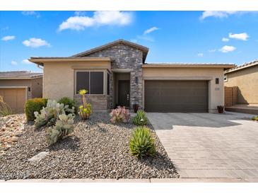 Front view of a single-story home with desert landscaping at 23624 N 76Th Pl, Scottsdale, AZ 85255