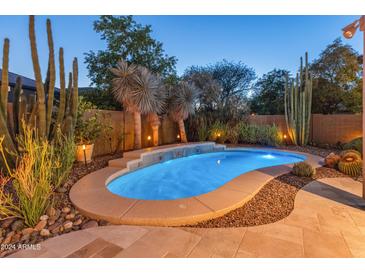 Relaxing kidney shaped pool with desert landscaping at 3331 W Hemingway Ln, Anthem, AZ 85086