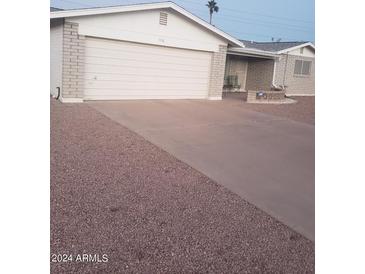 Attached garage with driveway at 908 S Ocotillo Dr, Apache Junction, AZ 85120