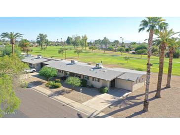 Aerial view of single-story home near golf course at 10413 W Oakmont Dr, Sun City, AZ 85351