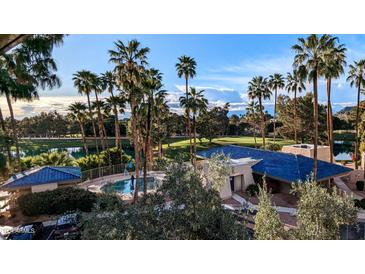 View of the community pool and surrounding grounds at 5136 N 31St Pl # 648, Phoenix, AZ 85016