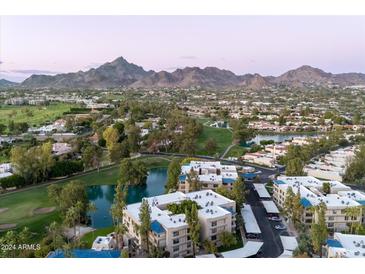 Aerial view of community near golf course and mountains at 5136 N 31St Pl # 648, Phoenix, AZ 85016