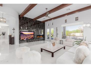 Spacious living room with fireplace and high ceilings at 8536 E Preserve Way, Scottsdale, AZ 85266