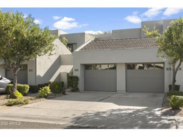 Attractive exterior of a townhome with a two-car garage at 7700 E Gainey Ranch Rd # 206, Scottsdale, AZ 85258