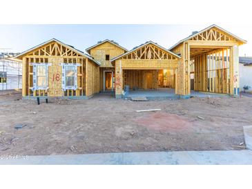 New home construction showing framing and exterior features at 7575 W Gelding Dr, Peoria, AZ 85381