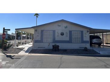 Single-wide manufactured home with carport at 2400 E Baseline Ave # 301, Apache Junction, AZ 85119