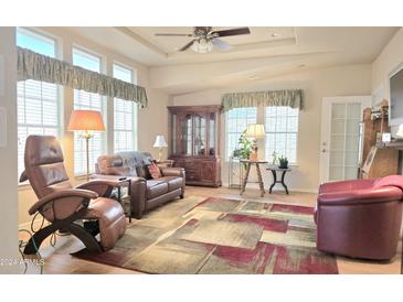 Spacious living room with comfortable seating and large windows at 3301 S Goldfield Rd -- # 4017, Apache Junction, AZ 85120