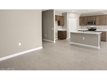 Modern kitchen with island and plenty of cabinet space at 1471 S 239Th Dr, Buckeye, AZ 85326