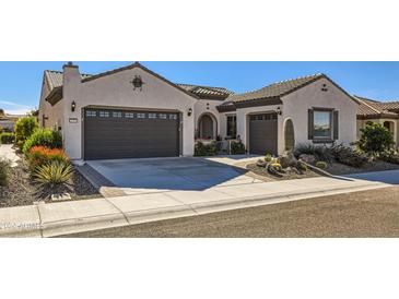 Two-story home with a two-car garage and desert landscaping at 25979 W Taro Dr, Buckeye, AZ 85396