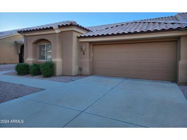 Tan garage door and walkway at a tan home at 5830 E Mckellips Rd # 8, Mesa, AZ 85215