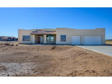 Single-story home with stucco exterior and two-car garage at 29408 N 244Th Dr, Wittmann, AZ 85361