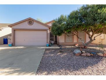 Single story home with a two-car garage and mature landscaping at 1871 E Westchester Dr, Chandler, AZ 85249