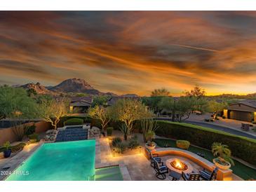 Luxury home with a pool, fire pit, and mountain views at 27601 N 110Th Pl, Scottsdale, AZ 85262