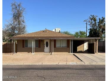 Ranch style home with front yard and carport at 3542 E Earll Dr, Phoenix, AZ 85018