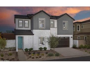 Two story home with gray siding and teal door at 9237 E Sector Dr, Mesa, AZ 85212