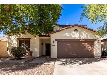 Two-story house with a brown garage door at 45226 W Miramar Rd, Maricopa, AZ 85139