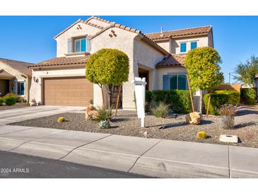 Two-story house with landscaped yard and a two-car garage at 25954 W Sequoia Dr, Buckeye, AZ 85396