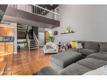 Open living space with lofted ceilings and a comfortable seating area at 6508 N 10Th Pl, Phoenix, AZ 85014