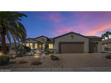 Single-story home with desert landscaping and two-car garage at 19926 N Organ Pipe Dr, Surprise, AZ 85374