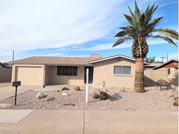 Charming ranch-style home with desert landscaping at 2044 W 9Th Ave, Apache Junction, AZ 85120
