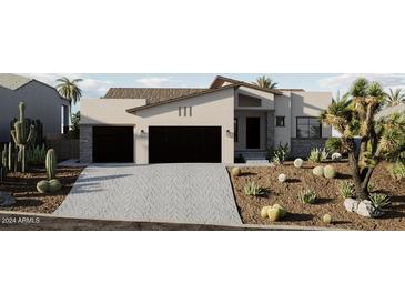 Stunning modern home with a two-car garage and desert landscaping at 15528 E Chicory Dr, Fountain Hills, AZ 85268