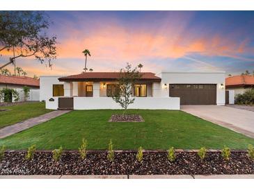 Modern single story home with landscaped front yard at 8014 E Del Tesoro Dr, Scottsdale, AZ 85258