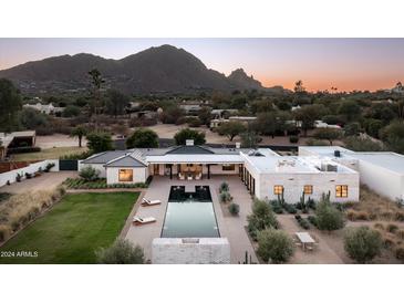 Luxury home with pool and expansive backyard, offering stunning mountain views at 5815 N Kiva Ln, Paradise Valley, AZ 85253