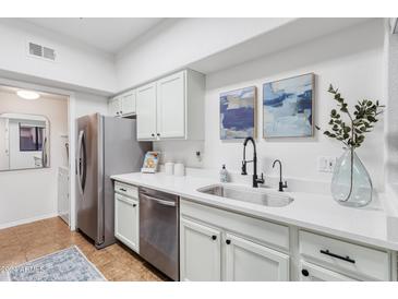 Modern kitchen with stainless steel appliances and white cabinets at 10401 N Saguaro Blvd # 224, Fountain Hills, AZ 85268