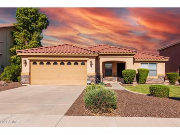 One-story home with tan exterior and red tile roof at 2754 W Tanner Ranch Rd, San Tan Valley, AZ 85144