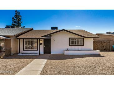 Cute single story home with a well maintained front yard and walkway at 4141 W Pasadena Ave, Phoenix, AZ 85019