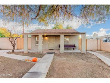 Charming bungalow style home with covered porch and walkway at 821 E Roeser Rd, Phoenix, AZ 85040